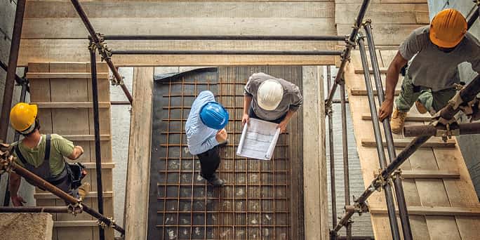 2 contractors on a construction worksite