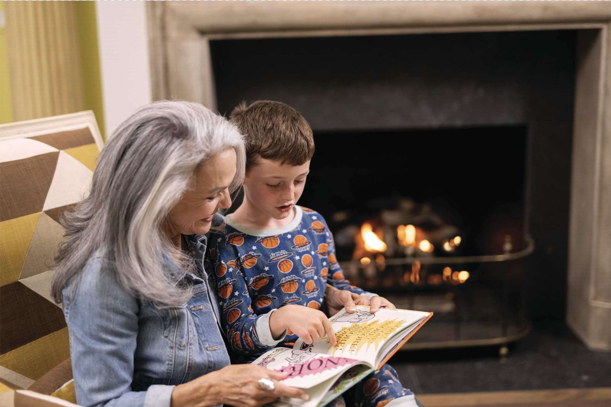 Reading with Grandma by Fireplace
