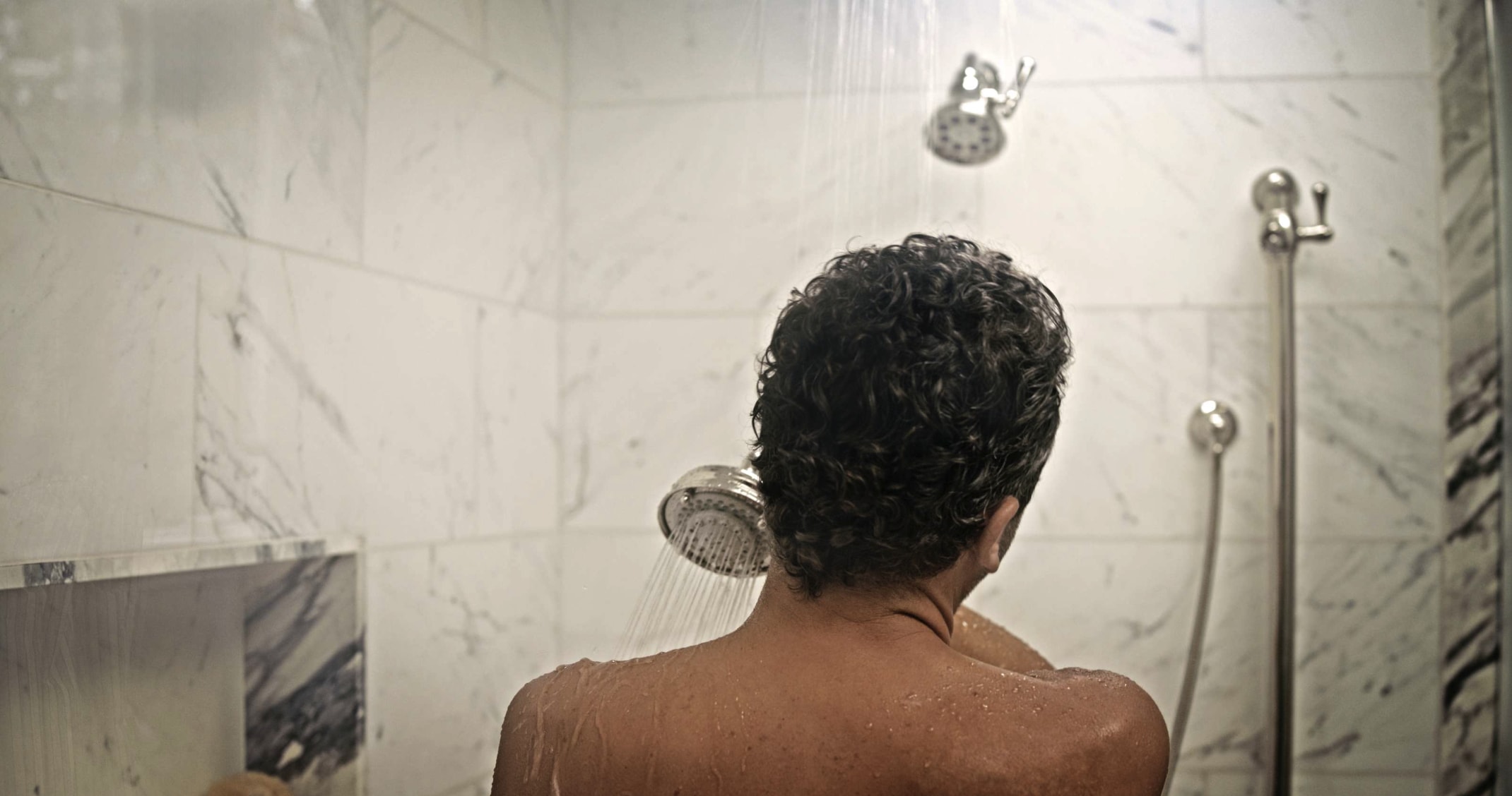 Man in Shower with Nozzle